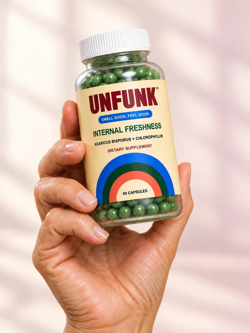 Hand holding UNFUNK bottle
